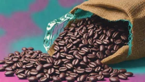 Close up view of high quality whole roasted arabica coffee beans in a wooden bowl.