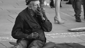 A man performing a chaotic public gesture for the person he loves in a city setting.