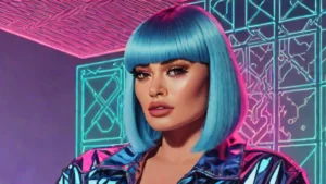 Adult woman with a pastel blue bob hairstyle and bangs posing against a projected backdrop.