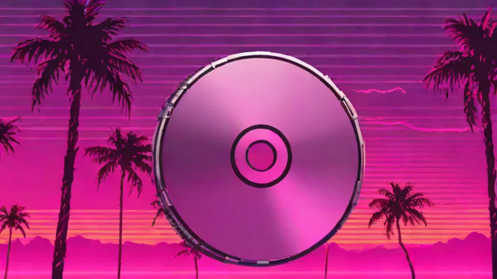 A silver DVD resting on a dark reflective surface with a soft blurred background.