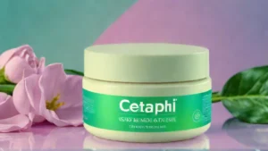 A tube of Cetaphil Skin Activator Firming Body Cream sitting on a white marble surface.