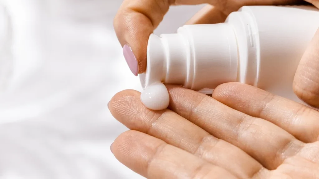 Neutrogena Ultra Sheer sunscreen bottles resting on a bright marble surface in natural sunlight.