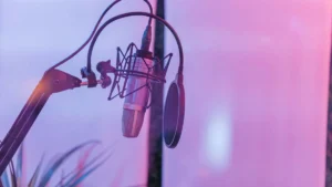 A television remote and headphones resting on a surface representing a new Netflix documentary release.