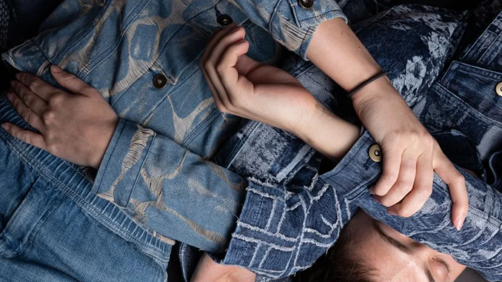 A woman wearing comfortable clothing featuring realistic denim texture prints.